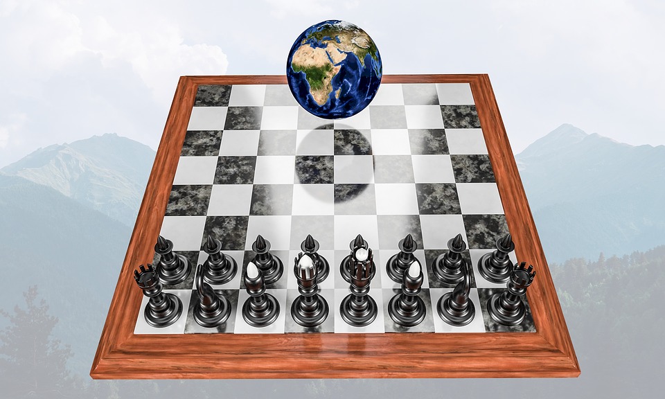 Graphic depicts chessboard with chess pieces on one side and a picture of the globe on the other.